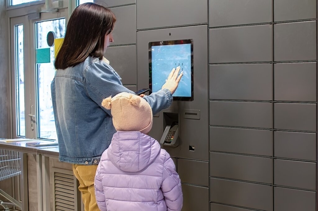 Receiving an order from a self-service parcel machine. Online shopping concept